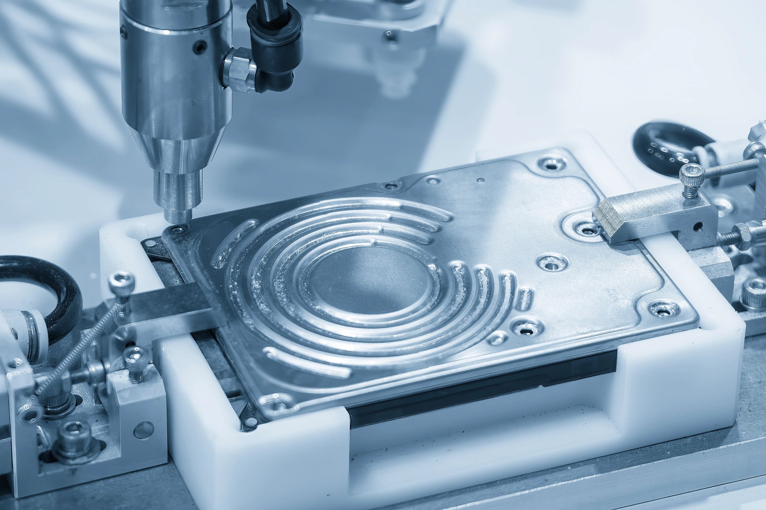 Machine engraving metal circular pattern.
